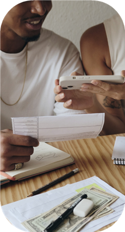 Person holding documents and tablet
